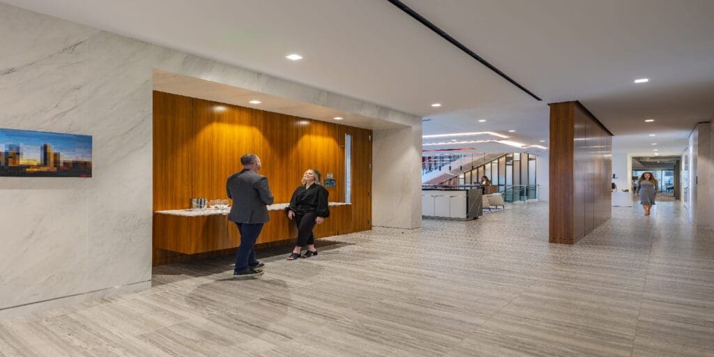 Two people looking at each other at JLL interiors